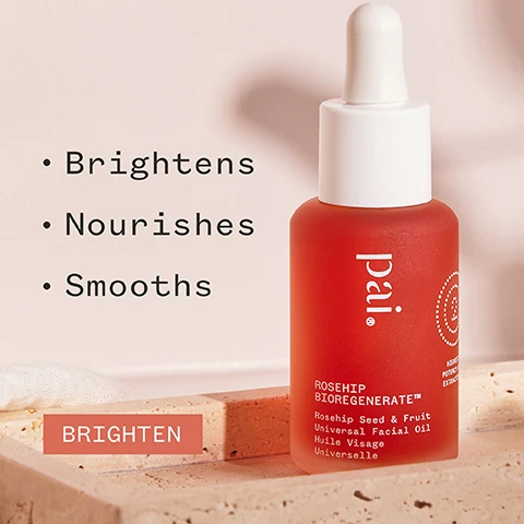 Image 1 - A red facial oil bottle with a dropper sits on a light background, with text beside it listing benefits: Brightens, Nourishes, Smooths, and a button labeled BRIGHTEN. Image 2 - A person is holding a small amber bottle of rosehip facial oil with text stating 700% more antioxidants than market competitors, featuring the product name Rosehip Bioregenerate, and logos for organic and vegan certifications.