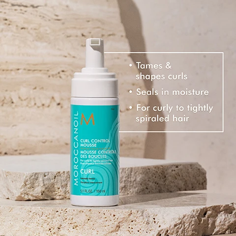 Image 3 - A bottle of Moroccanoil Curl Control Mousse is displayed on a textured stone surface, accompanied by text that reads: tames & shapes curls, seals in moisture, for curly to tightly spiraled hair.
Image 4 - Image showing a woman with wavy, shoulder-length hair on the left labeled BEFORE and the same woman with fuller, curly hair on the right labeled AFTER.
Image 7 - Image shows three Moroccanoil products for frizz-free curl styling, including Intense Curl Cream, Curl Defining Cream, and Curl Control Mousse, with text stating FRIZZ-FREE CURL STYLING, 3 WAYS, along with descriptions of each products function.