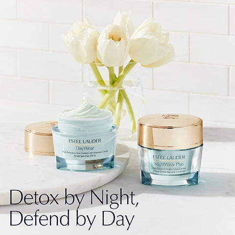 Image 1 - Two jars of Estee Lauder cream, one open showing green cream, on a marble surface with flowers in the background, with the text Detox by Night, Defend by Day.
Image 2 - A collection of Estée Lauder DayWear creams and gels on a wet blue surface next to text that reads Find Your DayWear with labels for 24H Moisture Creme Cooling Eye Night Creme Sorbet Creme and Matte Gel Creme.
Image 3 - Four jars of Estee Lauder skincare products are shown with the text More Than Moisture Lasting hydration and nourishment plus powerful, youth-infusing technologies targeted to your skins specific needs. Drink up. ESTEE LAUDER DayWear Multi-Protection Anti-Oxidant 24H-Moisture Creme Broad Spectrum SPF 15 DAYWEAR Anti-Oxidant 24H-Moisture Creme SPF 15 Protect & Prevent With our powerful Super Anti-Oxidant Complex and broad spectrum sunscreen. ESTEE LAUDER Revitalizing Supreme+ Youth Power Creme Crème révélatrice de jeunesse REVITALIZING SUPREME+ Youth Power Creme Lift & Firm Featuring our 99% naturally-derived Hibiscus Morning Bloom Extract, our exclusive Moringa Extract and Collagen-Boosting Technology. ESTEE LAUDER Revitalizing Supreme+ Bright Power Soft Creme Crème douceur éclat REVITALIZING SUPREME+ BRIGHT Power Soft Creme Firm & Glow Includes 99% naturally-derived Beautyberry Extract & Vitamin C plus our exclusive Moringa Extract. ESTEE LAUDER Resilience Multi-Effect Tri-Peptide Face and Neck Creme Broad Spectrum SPF 15 RESILIENCE MULTI-EFFECT Face and Neck Creme SPF 15 Lift & Plump Includes our advanced Tri-Peptide Complex plus IR-Defense Technology.