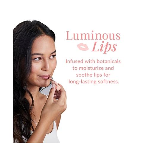 Image 1 - A woman with long, dark hair is applying lip balm with a slight smile, and the image includes the text Luminous Lips Infused with botanicals to moisturize and soothe lips for long-lasting softness.
Image 2 - An arrangement of various oils and extracts is shown, with labeled ingredients including organic olive oil, squalane, ginseng root extract, and lanolin, along with their benefits.
Image 3 - A close-up of a person applying a lip cream to their lips, with a smile revealing white teeth, and the text: Can be worn alone or over lipstick to impart a luminous, natural shine.
Image 4 - Image shows a beauty product layout with four items outlined as steps for enhancing lip and eye makeup, including a pink Color Lip Cream, Liquid Eyeliner EX, Mascara Perfect Pro Double Protection, and a peach Lip Cream, with the headings Flawless Features: Lips + Eyes and 4 Steps to Boost Your Routine along with descriptive text for each step.
Image 5 - An arrangement of colorful lip cream products on a pink background, featuring five lipsticks in various shades and packaging, with the text Lip Cream Collection and Treat your lips to a kiss of moisture.