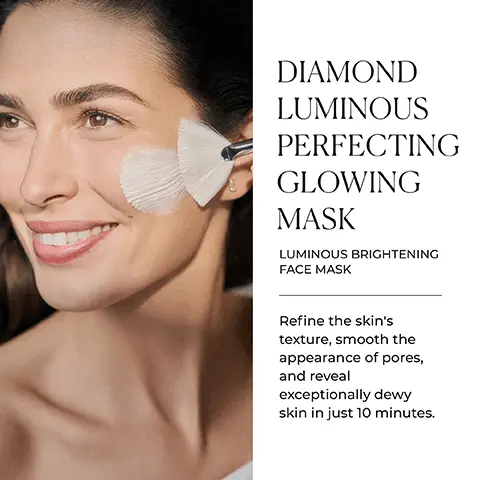 Image 1 - A woman with a radiant smile applies a cream to her cheek using a brush, accompanied by text that reads DIAMOND LUMINOUS PERFECTING GLOWING MASK LUMINOUS BRIGHTENING FACE MASK Refine the skins texture, smooth the appearance of pores, and reveal exceptionally dewy skin in just 10 minutes.
Image 2 - A cosmetic tube of Natura Bissé Diamond Luminous Perfecting Glowing Mask is placed on a surface with a blurred background, accompanied by icons representing its key benefits: hydrates, smooths, and brightens, alongside the text KEY BENEFITS.
Image 3 - A tube of Naturabisse Diamond Luminous Glowing Mask is placed on a light surface, with text alongside stating your weekly perfecting ally, instant hydration and luminosity for an impressive glow, and icons representing gluten-free, alcohol-free, and suitable for vegans.
Image 4 - A clear glass container filled with a white powder sits beside a text box describing two skincare ingredients: Pro-Radiance Renewing Cocktail and Hydra-Comfort Trio, which promote skin tone evenness and moisture levels for a firmer complexion.
Image 5 - Image shows a collection of skincare products arranged on a surface, including several jars and tubes, with the text A BOOST OF RADIANCE and Preserve a youthful appearance for longer with global anti-aging skincare formulas.