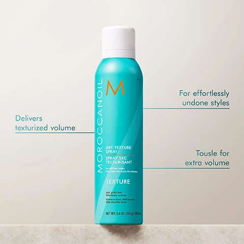 Image 2 - A turquoise spray can with a white cap labeled Moroccanoil Dry Texture Spray, featuring text that reads Delivers texturized volume, For effortlessly undone styles, and Tousle for extra volume, against a light background.
Image 3 - A woman with long, straight hair is shown on the left labeled BEFORE and on the right with wavy hair labeled AFTER, both wearing a light-colored top against a neutral background.
