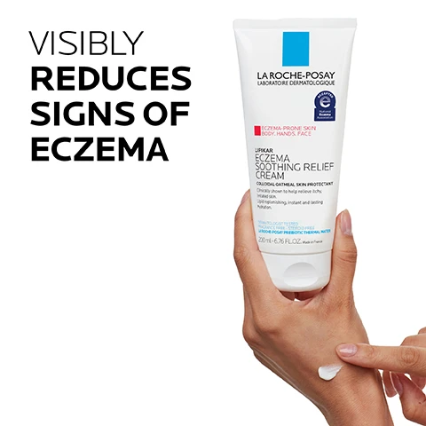 Image 1 - A person is holding a tube of La Roche-Posay Eczema Soothing Relief Cream with visible text stating VISIBLY REDUCES SIGNS OF ECZEMA alongside the product information on the packaging.
Image 2 - An image of a creamy white lotion with a smooth texture, accompanied by text that reads 1% colloidal oatmeal, + shea butter + prebiotic thermal spring water, soothing non-greasy cream texture, and relieves itchy & irritated skin.
Image 3 - A hand holding a tube of La Roche-Posay Lipikar Eczema Soothing Relief Cream with text stating DERMATOLOGIST RECOMMENDED and a quote from Dr. Hadley King about its use after bathing.
Image 4 - Image showing key dermatological ingredients, including 1% colloidal oatmeal labeled as a skin protectant, La Roche-Posay prebiotic thermal spring water described as a soothing antioxidant, and shea butter identified as an emollient with a note on its sourcing and properties.
Image 5 - An image featuring a logo for La Roche-Posay at the top, with four icons below it: a medical professional, a person with a hand on their face, a droplet of liquid, and a crossed-out bottle, accompanied by the text DERMATOLOGIST TESTED, ALLERGY TESTED, OIL-FREE/ NON-COMEDOGENIC, and FRAGRANCE-FREE.
Image 6 - Image shows two skincare products from La Roche-Posay: on the left is a bottle of Lipikar AP+ Wash labeled as CLEANSE, and on the right is a tube of Lipikar Eczema Cream labeled as SOOTHES, with the heading SOOTHE DRY IRRITATED SKIN above these products.