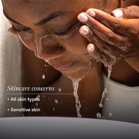 A close-up of a woman washing her face with water running down her cheeks, accompanied by text that reads Skincare concerns, + All skin types, + Sensitive skin.
