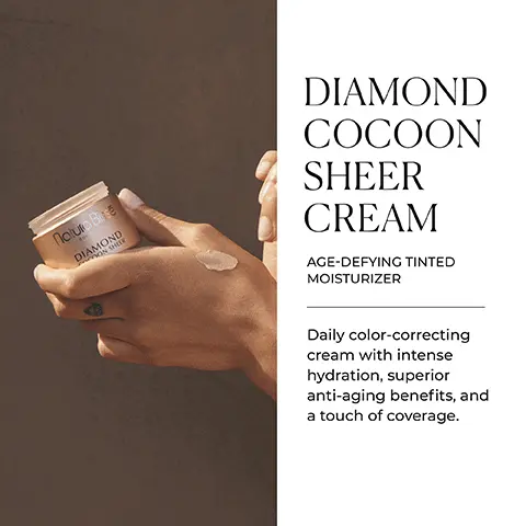 Image 1 - An image of a person holding a small jar labeled Diamond Cocoon Sheer Cream, with smooth skin and a dab of cream on their fingers, accompanied by text that describes it as an age-defying tinted moisturizer with daily color-correcting benefits.
Image 2 - A person holding a jar of skincare cream labeled Diamond Cocoon Sheer, next to icons representing key benefits: corrects, rejuvenates, hydrates, and restores, with the text KEY BENEFITS above.
Image 3 - A woman with dark hair smiles while holding a skincare product in her hand, with text beside her stating YOUR NO-MAKEUP MAKEUP ALLY and further describing the product as formulated with a velvety, lightweight texture and a sheer tint that blends seamlessly with most skin tones; icons indicate it is gluten free, alcohol free, and suitable for vegans.
Image 4 - A close-up image of a clear, round dish with bubbles and a textured surface, accompanied by text that reads: SCIENCE BEHIND IT HYALURONIC ACID & AQUA MAGNET Deeply hydrates and retains moisture for softer, plumper skin. ANTIOXIDANT COCKTAIL Boosts skin resiliency to preserve a supple, radiant complexion. DETOX COMPLEX & SIRT-AP PEPTIDE COMPLEX A combination of active ingredients to revitalize and rejuvenate the skin.
Image 5 - Image shows two skincare products from Natura Bissé, a cream jar and a serum bottle with a light wood background and a stone surface, accompanied by the text BARE SKIN ESSENTIALS Experience our multipurpose duo for busy lifestyles with anti-aging benefits and sheer coverage.