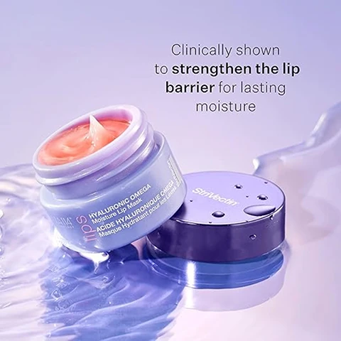 Image 1 - A jar of lip cream with a light blue and purple lid sits on a reflective surface, with visible text reading Clinically shown to strengthen the lip barrier for lasting moisture and descriptions of the products ingredients around the jar.
Image 2 - A round petri dish contains a light yellow oil labeled Omega-Rich Fatty Acids, another dish holds dried red pomegranate flowers labeled Moroccan Pomegranate Flower Extract, and a third dish contains small blue beads labeled Hyaluronic Acid.
Image 3 - A close-up image featuring a pink background with a transparent overlay displaying the text 100% showed immediate improvement in moisturization based on immediate expert grading results on 32 subjects.
Image 4 - Image shows two close-up photos of lips: the top half labeled BEFORE with slightly dry and less glossy lips, and the bottom half labeled AFTER 1 HOUR with plump, smooth, and glossy lips. The bottom caption reads *Unretouched photos. Individual results will vary.
Image 5 - A creamy, pink cosmetic balm is shown with an arrow pointing to it, and the visible text describes it as rich, velvety, blackberry-flavored balm.