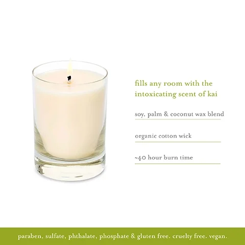 Image 1 - A white candle in a clear glass container with a lit wick, accompanied by text stating fills any room with the intoxicating scent of kai, soy, palm & coconut wax blend, organic cotton wick, ~40 hour burn time, paraben, sulfate, phthalate, phosphate & gluten free, cruelty free, vegan.