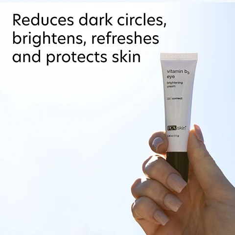 Image 1 - A person holds a small tube of vitamin B3 eye brightening cream against a light background, with text beside it that reads reduces dark circles, brightens, refreshes and protects skin.
Image 2 - A close-up image of a person applying cream under their eye, with visible dots of cream on their skin; the text includes Instantly brighter eyes and Diminish the look of dark circles and give your tired-looking eyes a brightening boost.
Image 3 - Image of a tube of vitamin B3 eye brightening cream from PCA Skin, with text highlighting its benefits: balances an uneven complexion, improves the appearance of fine lines, and helps support skin elasticity. The title reads: The multitasking superstar: Niacinamide (vitamin B3).
Image 4 - Image showing a comparison of the effects of Vitamin B3 Eye Brightening Cream, with a Before photo on the left showing a womans closed eye and an After 12 Weeks photo on the right showing noticeable improvement in under-eye brightness; visible text includes Vitamin B3 Eye Brightening Cream, Before, After 12 Weeks, and Visible improvements of under-eye brightness* with a footnote stating *When used twice daily.
Image 5 - A close-up view of a cream or lotion in a clear dish, with text describing three ingredients: Niacinamide (5%) stating it improves barrier function, Daisy Flower and Hawkweed Extracts that reduce dark circles, and Goji Berry Fruit Extract for smoothing under eyes.
Image 6 - Image shows a woman applying a skin treatment product around her eye area, with two steps for application: step 1 describes applying the product after cleansing and toning, while step 2 suggests using SPF during the day and moisturizer in the evening.
Image 7 - Three women of diverse backgrounds smile together, with text above them stating for dry, oily, combination, normal and sensitive skin for preventative and aging skin concerns.
Image 8 - Image shows two skincare products from PCA Skin: a small tube labeled vitamin b3 eye brightening cream positioned as Step 1 on the left, and a larger bottle labeled vitamin b3 brightening serum as Step 2 on the right, with the text Complete your regimen Total skin brightening for brighter eyes and a more radiant complexion above them.
Image 9 - Image features a blue laboratory flask icon above text that reads Innovators in healthy skin for 30 years At PCA SKIN®, we use clinically-backed research and science to develop safe and effective products that deliver visible results for healthy, beautiful skin.