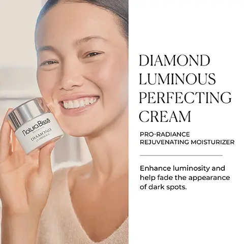 Image 1 - A smiling woman holds a jar of product labeled Naiia Bisse DIAMOND LUMINOUS PERFECTING CREAM PRO-RADIANCE REJUVENATING MOISTURIZER while text beside her reads Enhance luminosity and help fade the appearance of dark spots.
Image 2 - A jar of Natura Bissé Diamond Luminous cream is placed on a stack of books, alongside icons representing key benefits: hydrates, rejuvenates, brightens, and blurs dark spots; the text KEY BENEFITS is displayed above.
Image 3 - A smiling woman with a skincare product applied to her cheek is shown, next to the text that reads READY. SET. BRIGHTEN! below it states A daily use moisturizer designed to brighten and improve dull, uneven skin tones, along with three icons labeled GLUTEN FREE, OIL FREE, and SUITABLE FOR VEGANS.
Image 4 - A close-up image of a clear dish containing white powder, accompanied by text outlining ingredients and benefits for skin care, including Hyaluronic Acid, Alpha-Arbutin, and Lumiyouth Complex with niacinamide.
Image 5 - A collection of skincare products arranged on a light surface, featuring various containers labeled Natura Bissé, with the text A Boost of Radiance and Preserve a youthful appearance for longer with global anti-aging skincare formulas displayed above.