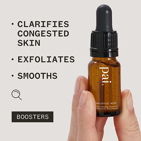 Image 1 - A person holds a small amber dropper bottle labeled pai Salicylic Acid Clarifying Booster with text beside it listing benefits: clarifies congested skin, exfoliates, and smooths, along with the word BOOSTERS and a magnifying glass icon.
Image 2 - A close-up of a persons hand holding a brown dropper bottle labeled Pai with visible text that reads BALYLIC ACID and Concentrate, alongside a quote that says STOPS A BREAKOUT IN ITS TRACKS AND KEEPS MY SKIN BLEMISH-FREE. attributed to Jane E, with symbols for vegan certification, organic certification, and a Certified B Corporation logo.
