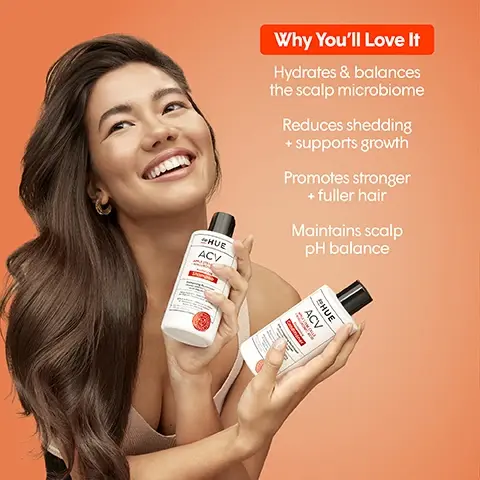 Image 2 - A smiling woman with long, wavy hair holds two bottles of deHUE ACV shampoo against an orange background, with text that highlights benefits including hydration, reducing shedding, promoting stronger hair, and maintaining scalp pH balance.
Image 3 - Two smiling women with long, wavy hair and curly hair pose together against a bright orange background, accompanied by the text Made with artisanal-crafted Apple Cider Vinegar, ensuring premium quality + results.
Image 4 - Image shows a collection of hair care products from dpHUE arranged against an orange background, including shampoo, conditioner, scalp serum, hair rinse, and hair masque, with visible text stating hair care you can trust, and icons for color safe, paraben free, SLS & SLES sulfate free, Leaping Bunny certified, and pH balanced.