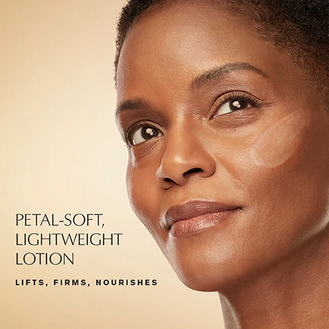 Image 1 - A close-up of a woman with glowing skin, looking upwards, with a visible smear of lotion on her cheek, alongside the text Petal-Soft, Lightweight Lotion, Lifts, Firms, Nourishes. Image 2 - A white and gold bottle of Estee Lauder Revitalizing Supreme+ Youth Power Soft Milky Lotion Crème fluide révélatrice de jeunesse is surrounded by pink swirling cream, with text alongside reading REVITALIZING SUPREME+ DOES NOT INCLUDE Parabens Phthalates Mineral Oil Oil Sodium Lauryl Sulfate Sulfites Petrolatum Drying Alcohol. Image 3 - The image features two Estee Lauder Revitalizing Supreme+ products: a gold jar of Youth Power Creme with a swatch of cream and accompanying text Silky, Cocooning Creme Estee Lauder Revitalizing Supreme+ Youth Power Creme Creme revelatrice de jeunesse, and a light-colored bottle of Youth Power Soft Milky Lotion surrounded by drops with accompanying text Petal-Soft, Lightweight Lotion Estee Lauder Revitalizing Supreme+ Youth Power Soft Milky Lotion Creme fluide revelatrice de jeunesse.