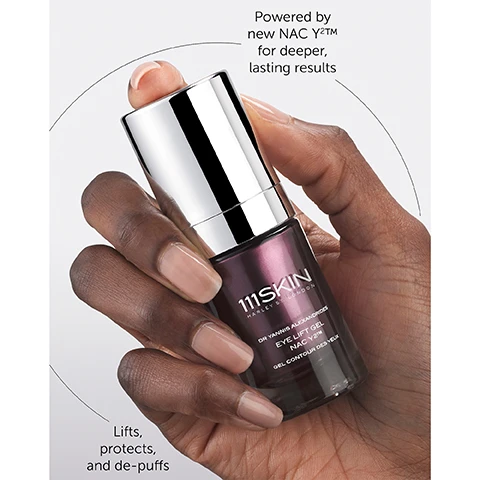 Image 1 - A hand with light brown skin is holding a sleek, silver and purple bottle of 111SKIN eye lift gel with text beside it that reads, Powered by new NAC Y2TM for deeper, lasting results and Lifts, protects, and de-puffs.
Image 2 - A smiling woman with long dark hair is applying a skincare product near her eye, accompanied by text stating: 35% reduction in the amount of wrinkles in just 2 weeks*, 2 weeks proven to lift the eye area in 2 weeks***, 2 weeks proven to minimise the appearance of dark circles in 2 weeks***.
Image 3 - Image showing a comparison of the eye area before and after six weeks of using the 111SKIN Eye Lift Gel NAC Y2™, with visible text stating Eye Lift Gel NAC Y2™, and Clinically proven to visibly improve the appearance of fine lines around the eyes.
Image 4 - A silver-capped bottle of 111SKIN Eye Lift Gel sits on a white background with text annotations stating benefits: Reduce wrinkles in two weeks by -35%, Proven to lift the eye area in just 2 weeks, and Minimise dark circles in just 4 weeks.