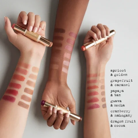 swatches of apricot and grapefruit, grapefruit and caramel, papaya and tan, guava and mocha, cranberry and mahogany, dragon fruit and cocoa on three different skin tones