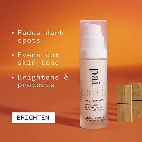 Image 1 - A bottle of Pai Fade Forward dark spot serum is shown against an orange background with text that states it fades dark spots, evens out skin tone, brightens and protects, and includes the words BRIGHTEN and CLINICALLY PROVEN FOR SENSITIVE SKIN. Image 2 - A hand holds a bottle of skincare serum labeled as Fade Forward, with the visible text stating 82% agreed it visibly reduced the appearance of dark spots, and additional certification icons for vegan and organic standards.