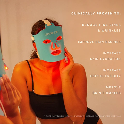 Image 1 - A woman wearing a blue light therapy mask is holding her face with one hand, while text on the right lists benefits including reduce fine lines & wrinkles, improve skin barrier, increase skin hydration, increase skin elasticity, and improve skin firmness; a note at the bottom mentions a third-party clinical trial over 8 weeks with 30 female participants ages 35-70 years.
Image 2 - Image shows a blue LED face mask with cutouts for the eyes, nose, and mouth, accompanied by text detailing the features: Flexible soft silicone, 50mW/2cm irradiance, 10 & 20 minute treatment times, 124 LED diodes of red 630nm & near infrared (NIR) 830nm, and convenient cordless design.
Image 3 - A side-by-side comparison of the skin around a persons eyes, showing a reduction in fine lines and wrinkles, with text indicating CLINICALLY PROVEN TO REDUCE FINE LINES & WRINKLES, BASELINE - 6,517px, WEEK 8 - 4,208px, and 35.43% DECREASE.
Image 4 - Image showing a comparison of an eye area before and after treatment for fine lines and wrinkles, with the left side labeled as Baseline - 11,699 and the right side labeled as Week 8 - 8,691px, indicating a 25.71% decrease in wrinkles. Text above reads CLINICALLY PROVEN TO REDUCE FINE LINES & WRINKLES.