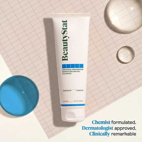 Image 1 - A white tube of BeautyStat Universal Microbiome Barrier Balancing Cleanser is centered on a light grid background, with blue and clear circular elements around it, and visible text stating Chemist formulated, Dermatologist approved, Clinically remarkable.
Image 2 - A close-up of a womans face covered in a foamy cleanser while she gently applies it with her fingers, accompanied by text stating Clinically Proven to Improve in 4 Weeks: 97% showed improvement in skin moisture 90% showed improvement in skin barrier function.
Image 3 - Image comparison showing the same woman’s cheek before treatment on the left and after four weeks of treatment on the right, with visible text reading BEFORE on the left and AFTER 4 WEEKS on the right.
Image 4 - Image shows a creamy, white skincare product with labels describing its ingredients and benefits: MICROSILVERBGT supports healthy microbiome, COCONUT SURFACTANTS fights skin irritations, PROPRIETARY MOISTURE BARRIER COMPLEX calms and reduces puffiness, SQUALANE hydrates and softens skins texture.
Image 5 - Image depicting the BeautyStat values, including icons for Cruelty Free, Patented Technology, Chemist-Created, and Clinically Tested, with the text Our BeautyStat VALUES at the top.