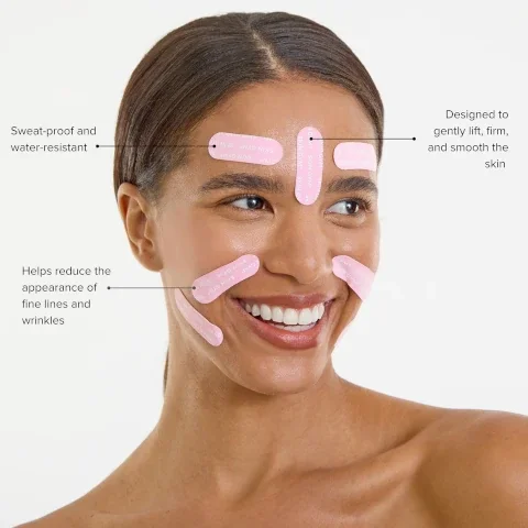 Image 5 - A person smiling wears pink strips on their forehead, cheeks, and chin that read SKIN GYM, with accompanying text Sweat-proof and water-resistant, Helps reduce the appearance of fine lines and wrinkles, and Designed to gently lift, firm, and smooth the skin.