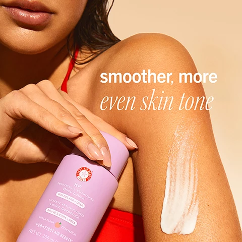 Image 1 - A close-up of a woman’s arm with a body lotion bottle in her hand, showcasing a lotion swatch applied to her skin, with the text smoother, more even skin tone visible in the background.
Image 2 - A person is holding a bottle of lavender lotion over their palm, pouring a small amount of cream while displaying smooth, tanned skin; the text on the image mentions benefits of reducing KP bumps, rough patches, and flakey skin in just 10 days.
Image 3 - A bottle of First Aid Beauty KP Smoothing and Brightening Body Lotion in a light purple color is surrounded by fresh peaches, with visible text highlighting ingredient benefits such as Lactic Acid for exfoliation and Glycerin plus Urea for hydration.
Image 4 - A creamy, white substance is shown in a wavy pattern, with text stating 97% of consumers with KP said this product made their skin look healthier + feel soft and a footnote about a consumer perception study.