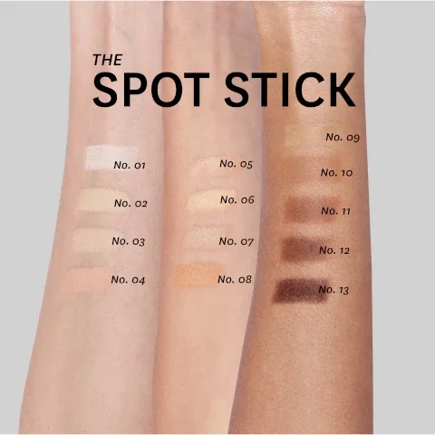 Image of several arms displaying swatches of various shades labeled with numbers; the visible text includes THE SPOT STICK along with labels for each shade from No. 01 to No. 13.