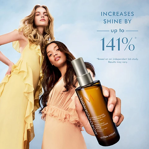 Image 1 - Two women, one with long blonde hair in a yellow dress and another with long brown hair in a peach dress, pose against a blue sky background, with the brown-haired woman holding a bottle of Moroccanoil Treatment Mist that displays the text MOROCCANOIL TREATMENT MIST For all hair types TRAITEMENT MOROCCANOIL BRUME Pour tous les types de cheveux ULTRA-LIGHT, while the image also presents large text reading INCREASES SHINE BY up to 141%* *Based on an independent lab study. Results may vary. Image 2 - A tilted amber Moroccanoil bottle with a gold pump and its reflection on a mirrored surface against a blue background, features text on the bottle MOROCCANOIL, M, MOROCCANOIL TREATMENT MIST, For all hair types, TRAITEMENT MOROCCANOIL BRUME, Pour tous les types de cheveux, ULTRA-LIGHT, and alongside two ingredient descriptions: ARGAN OIL Rich in antioxidants and essential fatty acids to help hydrate and soften hair, and LINSEED EXTRACT A good source of alpha-linolenic acid, which helps improve hair health. Image 3 - A woman with long blonde wavy hair holds a spray bottle in her right hand, looking at the camera, against a light blue background, with visible text that reads PRO TIPS, Designed for use on both wet and dry hair, Hands-free spray application, Adds nourishment to second-day hair, Great for refreshing curls, coils, and spirals, 95% agreed HAIR DOES NOT FEEL WEIGHED DOWN*, *Based on a consumer study, and MOROCCANOIL written vertically on the bottle. Image 4 - Four Moroccanoil hair treatment bottles and three color drops representing product consistency are displayed on a light blue background, with visible text that reads: EXPLORE THE MOROCCANOIL TREATMENT COLLECTION, MIST Weightless, cloud-like spray that provides hands-free application, ORIGINAL Original formulation, for all hair types, LIGHT Lighter in texture and color, for fine or light-colored hair, and PURPLE Violet pigments neutralize brassiness, for blonde, lightened, or grey hair.