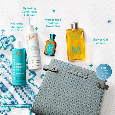 Image 2 - The image displays various Moroccanoil products including a teal bottle of Hydrating Shampoo Full Size, a white bottle of Hydrating Conditioner Full Size, a small amber bottle of Moroccanoil Treatment Travel Size, a clear golden bottle of Shower Gel Full Size, and a grey woven cosmetic bag with a blue label stating Free Woven Cosmetic Bag, all arranged on a white fabric background with blue embroidered patterns. Image 3 - The image features a light background with a blue x pattern border, displaying four Moroccanoil products: a blue Hydrating Shampoo bottle, a white Hydrating Conditioner bottle, a small amber Moroccanoil Treatment bottle, and a yellow Moroccanoil Shower Gel bottle, accompanied by visible text that reads Hydrating Shampoo & Conditioner Provide daily hydration for softer, healthier-looking hair, Moroccanoil Treatment Boosts shine, smooths frizz, and conditions, and Shower Gel Hydrates while gently cleansing, with additional bottle labels stating MOROCCANOIL HYDRATING SHAMPOO For all hair types HYDRATION Color-safe Sulfate, phosphate, paraben-free 8.5 FL.OZ. / 250 ml, MOROCCANOIL HYDRATING CONDITIONER For all hair types HYDRATION Color-safe Sulfate, phosphate, paraben-free 8.5 FL.OZ. / 250 ml, The Original MOROCCANOIL TREATMENT For all hair types Alcohol free 0.85 FL.OZ. / 25 ml, and FRAGRANCE ORIGINALE SHOWER GEL CLEANSING HYDRATION ARGAN OIL MOROCCANOIL 8.4 FL.OZ. / 250 ml. Image 4 - The image displays a light blue cross-stitch patterned border on a white background, with a light pink liquid droplet and white cream swirl at the top, a yellow liquid droplet in the middle, and a large yellow liquid puddle with a small yellow droplet at the bottom, each connected by a line to descriptive text on the right, which reads: NOURISHING, ANTIOXIDANT-RICH ARGAN OIL IN EVERY PRODUCT, PLUS... HYDRATING SHAMPOO & CONDITIONER Algae protects cuticle against dryness. MOROCCANOIL TREATMENT Linseed extract helps improve hair health. SHOWER GEL Glycerin helps increase skin’s elasticity.